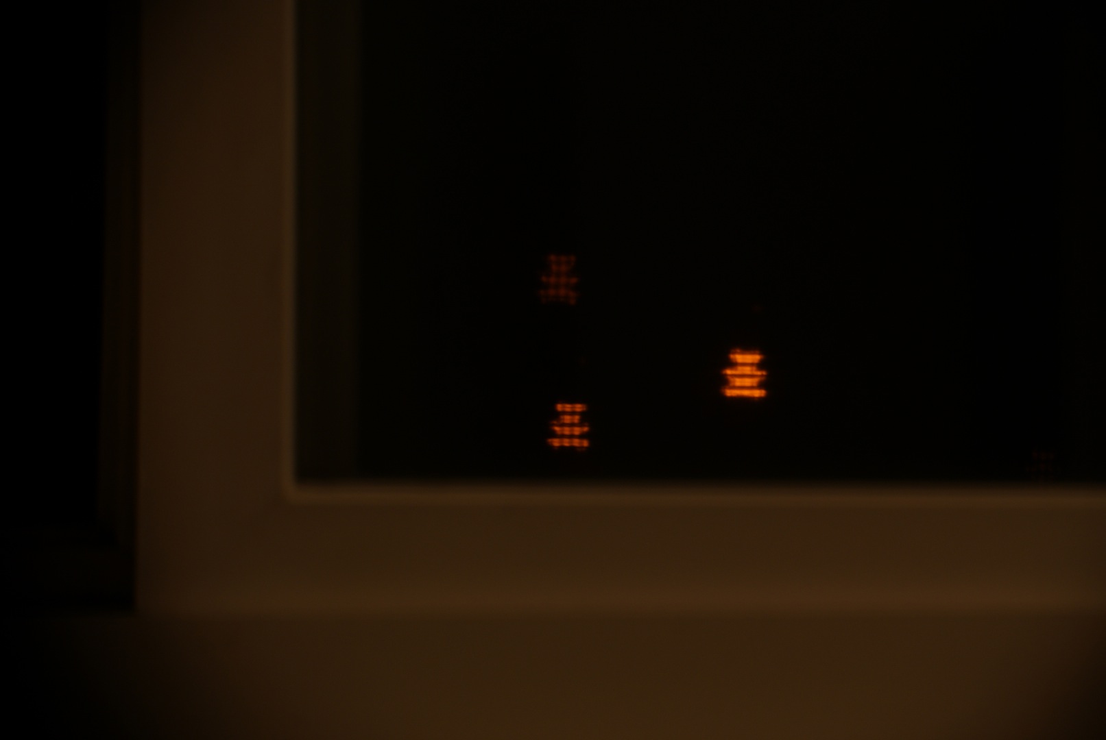 A view of the street lamps outside my window. Taken with a gummy bear shaped bokeh filter created from construction paper.